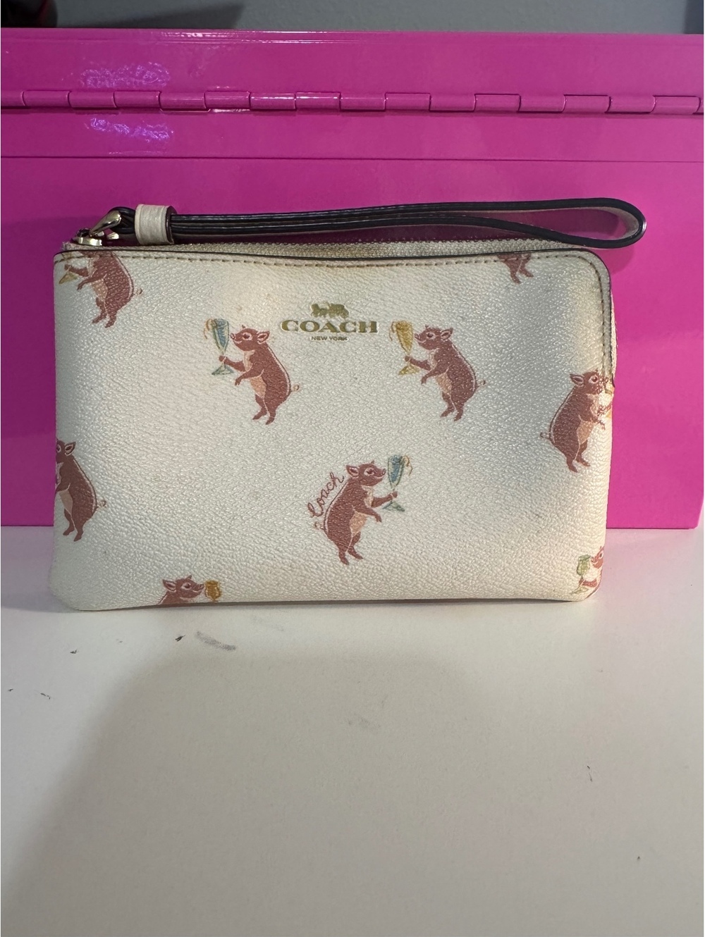 C49. Coach wristlet with whimsical pigs